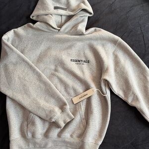 New dark oatmeal essentials hoodie with tag